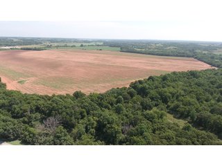 SW CORNER VIEW - SIGNIFICANT LAND & PRODUCING MINERALS AUCTION - 237 +/- SURFACE ACRES IN 4 TRACTS - 18 MINERAL PACKAGES IN GARVIN, MCCLAIN, GRADY & ROGER MILLS COUNTIES, OK - 6 Mo. AVG. CASH FLOW of $196,376/Mo.